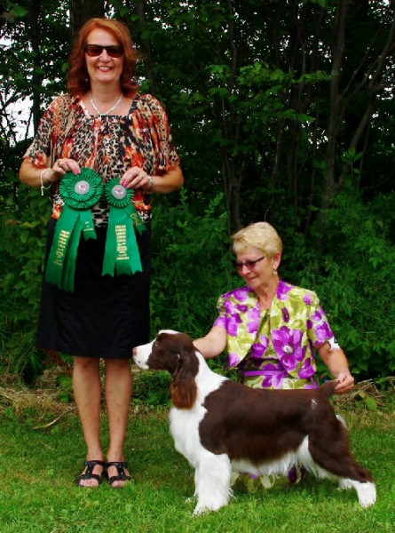 Dara winning Best Puppy In Sweepstakes under Judge Nathalie Clement